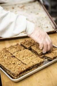 Hand of Woman Baking Squares