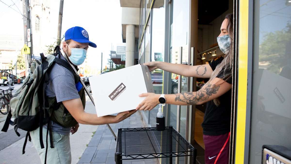A Good Foot courier delivers a package to a local Toronto business.