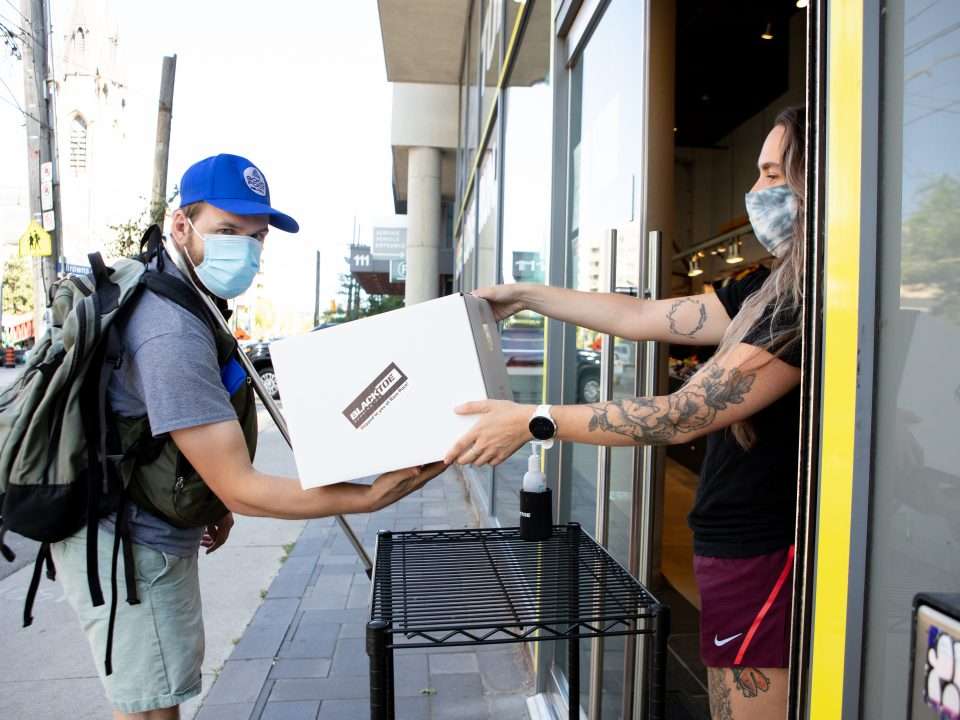 A Good Foot courier delivers a package to a local Toronto business.