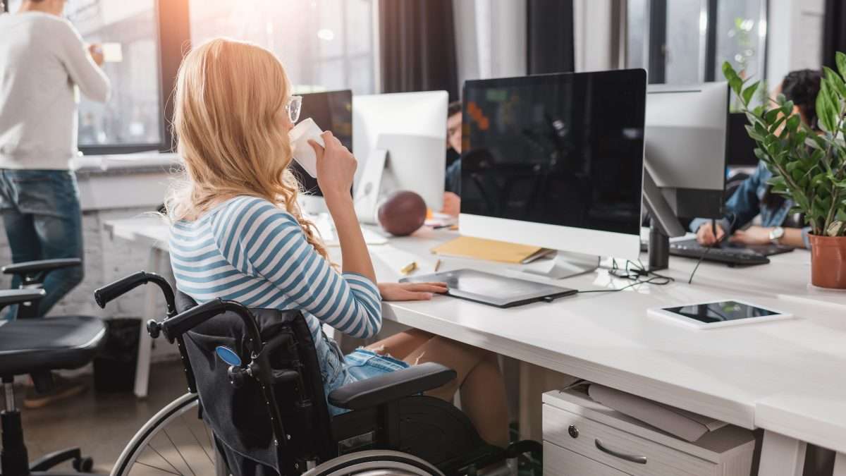 Person in a wheelchair using a computer